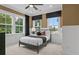 Cozy bedroom with natural light, a comfortable bed, and contemporary finishes at 4775 Wyat Farm Overlook, Cumming, GA 30040