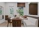 Bright breakfast nook with a built-in bench, modern finishes and view to outside at 4775 Wyat Farm Overlook, Cumming, GA 30040