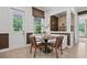 Stylish breakfast nook featuring a round table, banquette seating, and large windows at 4775 Wyat Farm Overlook, Cumming, GA 30040