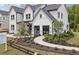 Elegant two-story home with manicured landscaping, stone accents, and welcoming walkway at 4775 Wyat Farm Overlook, Cumming, GA 30040