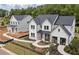 Stylish two-story home with dark roof, landscaped front yard, and inviting walkway at 4775 Wyat Farm Overlook, Cumming, GA 30040
