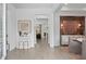 Bright foyer with light hardwood floors, modern decor, and open sightlines at 4775 Wyat Farm Overlook, Cumming, GA 30040