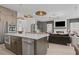 Modern kitchen island connects to living room, with sleek appliances and open layout perfect for entertaining at 4775 Wyat Farm Overlook, Cumming, GA 30040