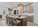 Spacious kitchen boasts a large center island, modern appliances, and pendant lighting for an inviting atmosphere at 4775 Wyat Farm Overlook, Cumming, GA 30040