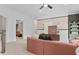 Bright living room featuring a cozy sofa, modern decor, and seamless flow to other areas at 4775 Wyat Farm Overlook, Cumming, GA 30040
