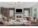 Comfortable living room showcases a fireplace, TV, and stylish furnishings, creating an inviting space at 4775 Wyat Farm Overlook, Cumming, GA 30040