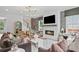 Cozy living room features a fireplace, staircase, and open layout, perfect for entertaining and relaxing at 4775 Wyat Farm Overlook, Cumming, GA 30040