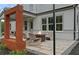 Stylish outdoor patio featuring a modern fire pit, comfortable seating, and a sleek water feature at 4775 Wyat Farm Overlook, Cumming, GA 30040
