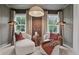 Cozy sitting area with comfortable chairs, natural light, and stylish accents at 4775 Wyat Farm Overlook, Cumming, GA 30040