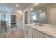 Modern bathroom featuring a double sink vanity, quartz countertops, and spacious glass-enclosed shower at 592 Eagles Nest Cir, Auburn, GA 30011