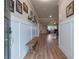 Inviting foyer with wood floors, bench seating, and a view into the open-concept living area at 592 Eagles Nest Cir, Auburn, GA 30011