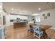 Spacious kitchen with white cabinets, stainless steel appliances, and an island with seating at 592 Eagles Nest Cir, Auburn, GA 30011