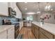 Contemporary kitchen with stainless appliances, an island, and a tile backsplash at 592 Eagles Nest Cir, Auburn, GA 30011