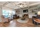 Comfortable living room features a cozy fireplace and plenty of natural light from large windows at 592 Eagles Nest Cir, Auburn, GA 30011
