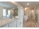 Luxurious main bathroom with a double vanity and a glass-enclosed shower at 592 Eagles Nest Cir, Auburn, GA 30011