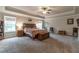 Large main bedroom with a tray ceiling and ample space for furnishings at 592 Eagles Nest Cir, Auburn, GA 30011