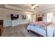 Bright main bedroom features a ceiling fan and generous square footage at 592 Eagles Nest Cir, Auburn, GA 30011