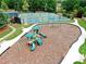 Community playground with slides and climbing equipment, near tennis and basketball courts at 592 Eagles Nest Cir, Auburn, GA 30011
