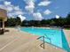 Sparkling community pool with diving area, lounge chairs, and well-maintained pool deck at 592 Eagles Nest Cir, Auburn, GA 30011