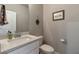Neutral-toned powder room features a modern sink and fixtures at 592 Eagles Nest Cir, Auburn, GA 30011