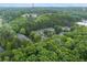 Aerial view of an apartment complex nestled among lush trees and foliage, highlighting the community's peaceful setting at 6204 Santa Fe Pkwy, Atlanta, GA 30350