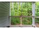 Balcony view overlooking a lush green forest, offering a serene outdoor space at 6204 Santa Fe Pkwy, Atlanta, GA 30350
