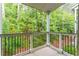 Balcony view overlooking a lush green forest, offering a serene outdoor space at 6204 Santa Fe Pkwy, Atlanta, GA 30350