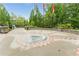Decorative park landmark featuring brick accents, stone pillars and multiple flag poles surrounded by lush greenery at 6204 Santa Fe Pkwy, Atlanta, GA 30350