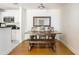 Charming dining area featuring a wooden table, bench seating, and is adjacent to the kitchen at 6204 Santa Fe Pkwy, Atlanta, GA 30350