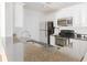 Modern kitchen with stainless steel appliances, granite counters and white cabinetry at 6204 Santa Fe Pkwy, Atlanta, GA 30350