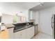 Stylish kitchen with granite countertops and stainless steel appliances open to living area at 6204 Santa Fe Pkwy, Atlanta, GA 30350
