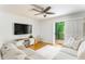Inviting living room showcasing a modern electric fireplace and sliding door access to a balcony at 6204 Santa Fe Pkwy, Atlanta, GA 30350