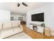 Comfortable living room that seamlessly connects to the dining area and a glimpse of the kitchen at 6204 Santa Fe Pkwy, Atlanta, GA 30350
