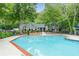 Resort-style community pool, lush landscaping, and clubhouse offers a relaxing atmosphere at 6204 Santa Fe Pkwy, Atlanta, GA 30350