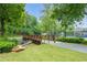 Charming walking trail featuring a small bridge, grassy area, and serene surroundings at 6204 Santa Fe Pkwy, Atlanta, GA 30350