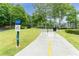 Well-maintained walking trail with lush greenery and a bridge in a vibrant community at 6204 Santa Fe Pkwy, Atlanta, GA 30350