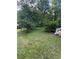 The backyard features ample green space with mature trees and a well-maintained lawn at 167 Mathews Se Cir, Marietta, GA 30067