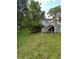 Spacious backyard with lush greenery, a charming deck, and mature trees at 167 Mathews Se Cir, Marietta, GA 30067