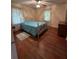 Bedroom with hardwood floors, a ceiling fan, and large windows at 167 Mathews Se Cir, Marietta, GA 30067