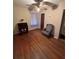 Bedroom with hardwood floors, ceiling fan and chair at 167 Mathews Se Cir, Marietta, GA 30067