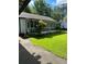 Inviting screened-in porch with views of the well-maintained lawn and mature trees at 167 Mathews Se Cir, Marietta, GA 30067