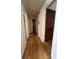 Hallway with hardwood floors and a view of multiple rooms at 167 Mathews Se Cir, Marietta, GA 30067