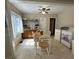Eat-in kitchen with tile flooring, wood cabinets, and adjacent laundry area at 167 Mathews Se Cir, Marietta, GA 30067
