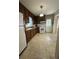 Functional kitchen with ample cabinet space, a white refrigerator, and a view to the backyard at 167 Mathews Se Cir, Marietta, GA 30067