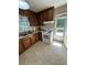 Well-equipped kitchen with wooden cabinets, a white stove, and a convenient door to the outside at 167 Mathews Se Cir, Marietta, GA 30067