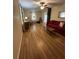 Spacious living room with hardwood floors, a cozy sofa, and vintage-inspired accents at 167 Mathews Se Cir, Marietta, GA 30067