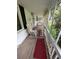 Relaxing screened porch featuring rocking chairs and rugs, perfect for enjoying the outdoors at 167 Mathews Se Cir, Marietta, GA 30067