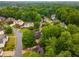Aerial view of a residential neighborhood with lush green trees and well-maintained homes at 2759 Thomashire Trce, Marietta, GA 30066