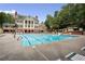 Large community pool with lounge chairs and surrounding trees perfect for relaxation at 2759 Thomashire Trce, Marietta, GA 30066