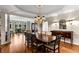 Formal dining room featuring hardwood floors, a large dining table and elegant chandelier lighting fixture at 2759 Thomashire Trce, Marietta, GA 30066